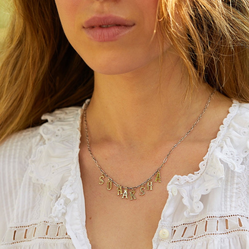 Suraksha Necklace silver chain gold letters